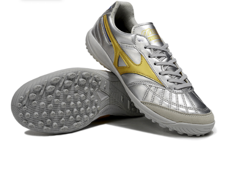 29. Mizuno TF – Plata/Oro